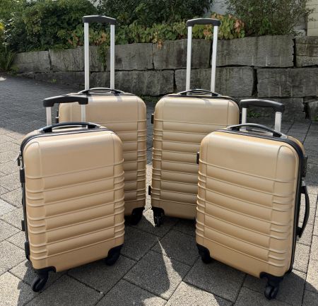 Reisekoffer‑Set – 4 × Hartschalen‑Trolleys in Gold